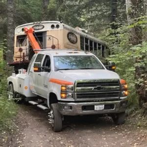 A truck with a crane on the back of it.