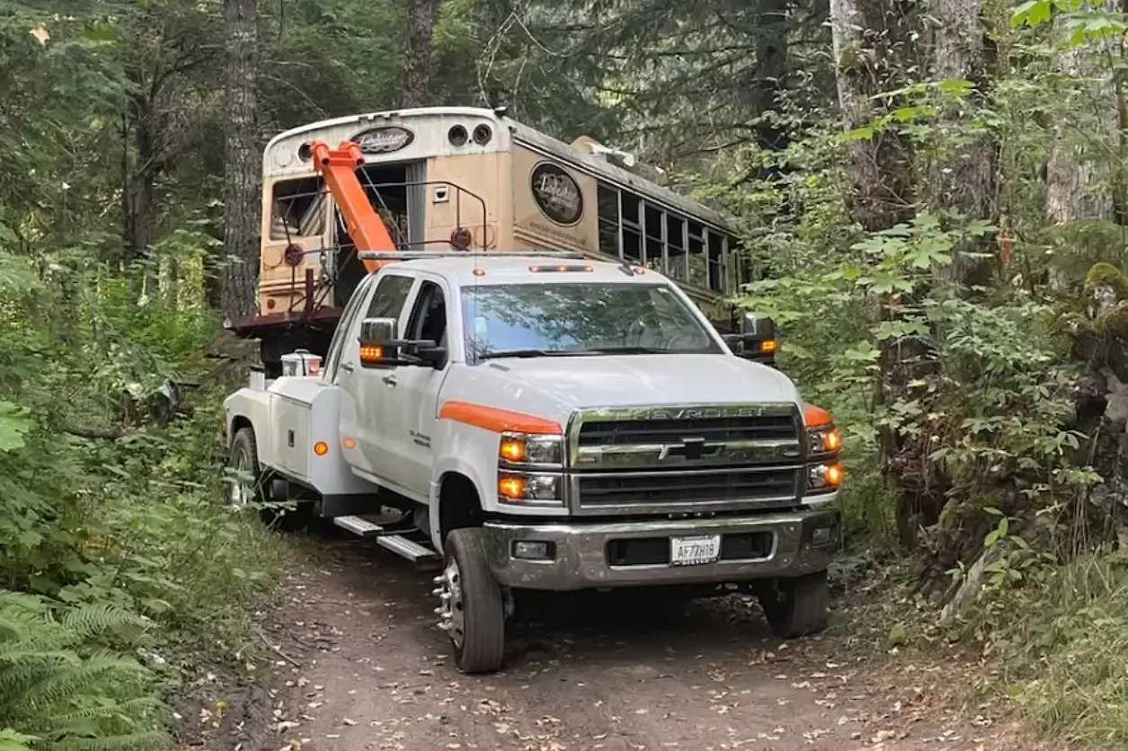 A truck with a crane on the back of it.