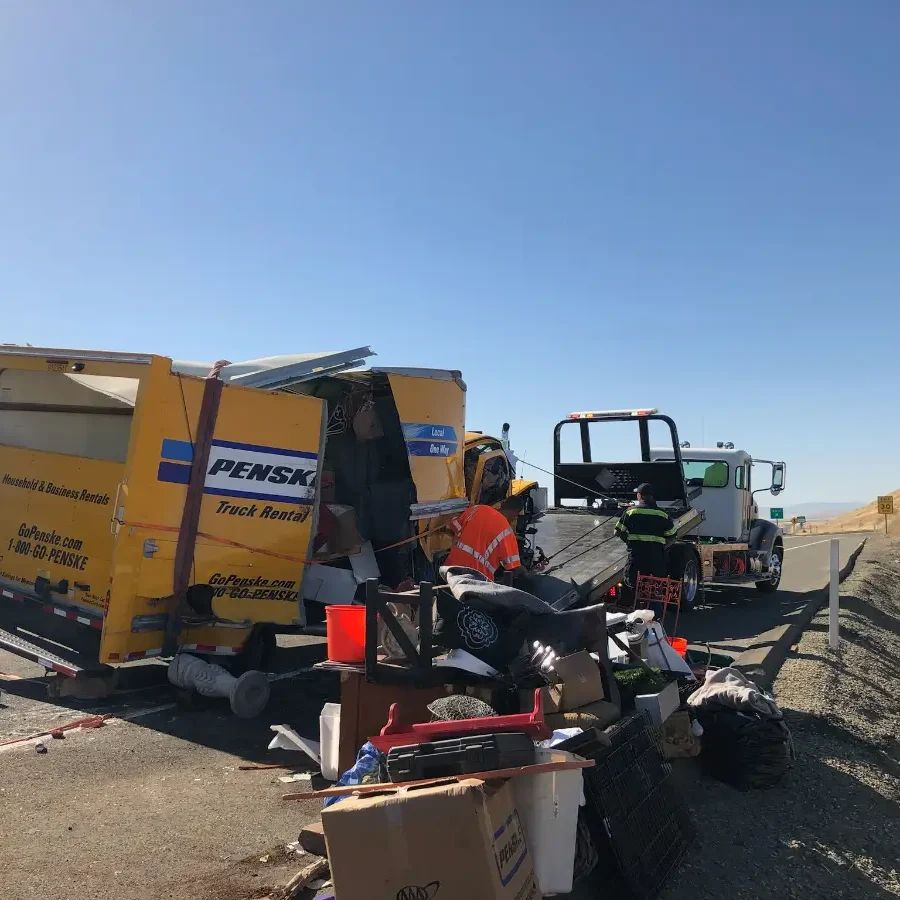 A dump truck is parked on the side of the road.